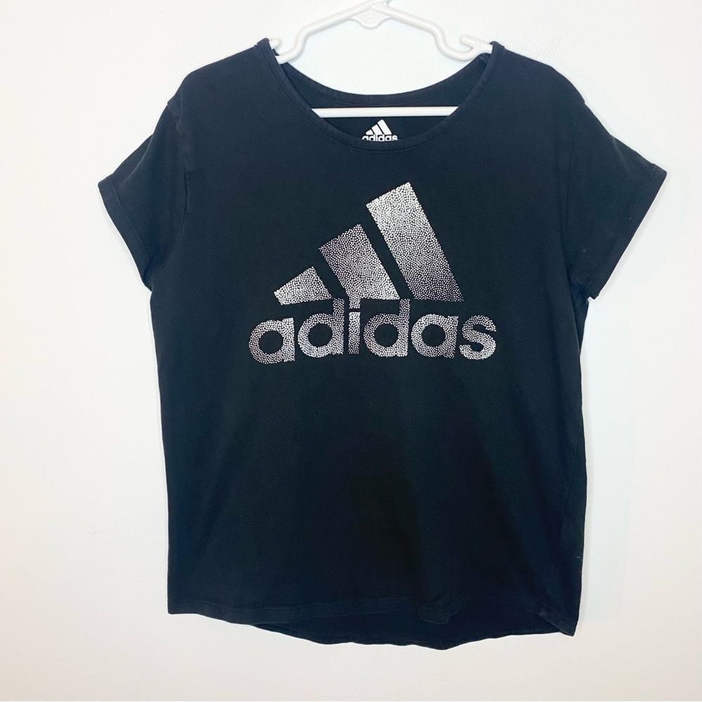 Girls black Adidas T with shimmer silver logo. Size 10/12.